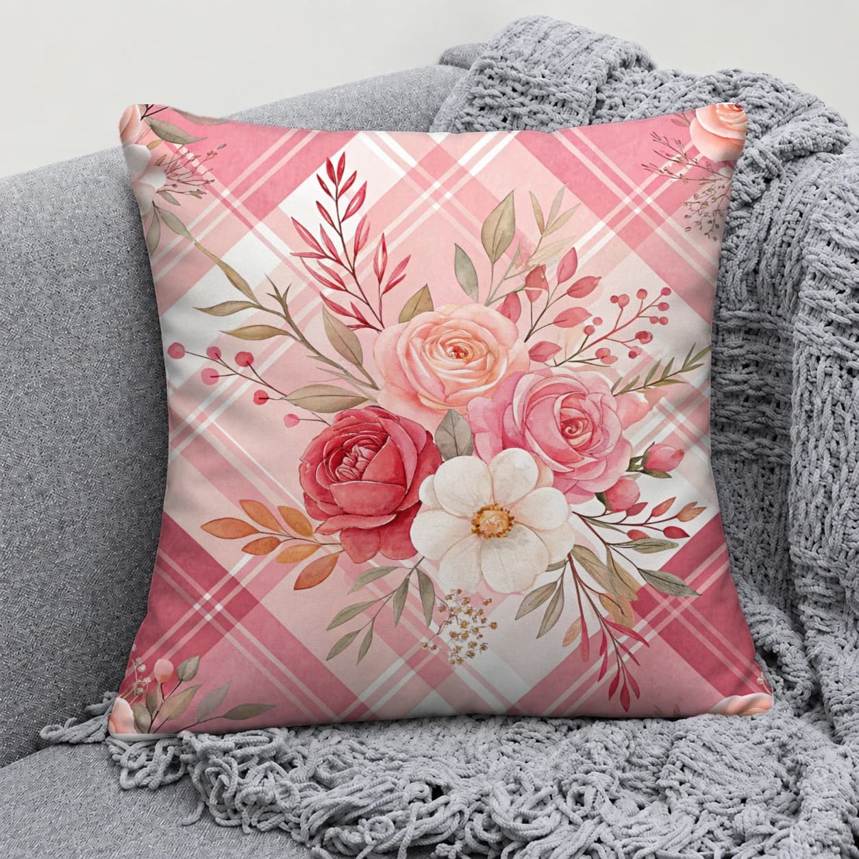 Floral pillow close-up on a grey sofa